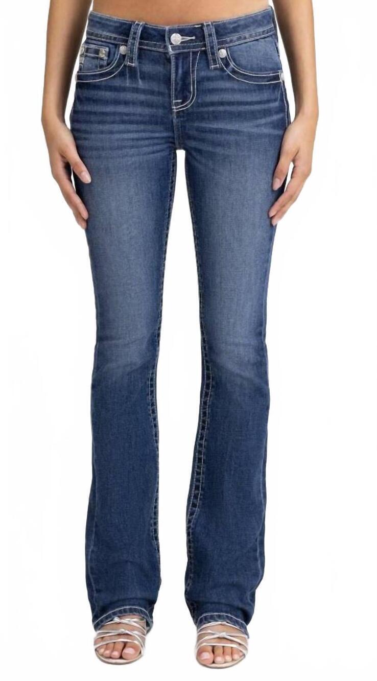 NEW MISS ME women's mid-rise fleur de lis boot cut jeans in distressed blue